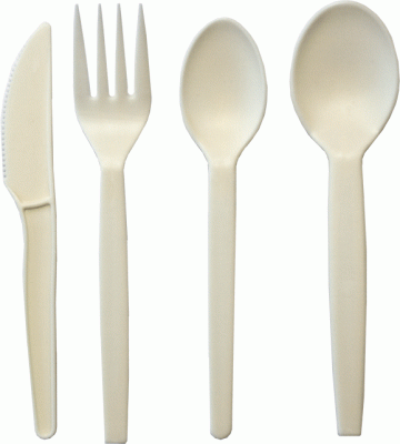 Single-use bio-based and eco-friendly beige cutlery: spoon, knife, fork.